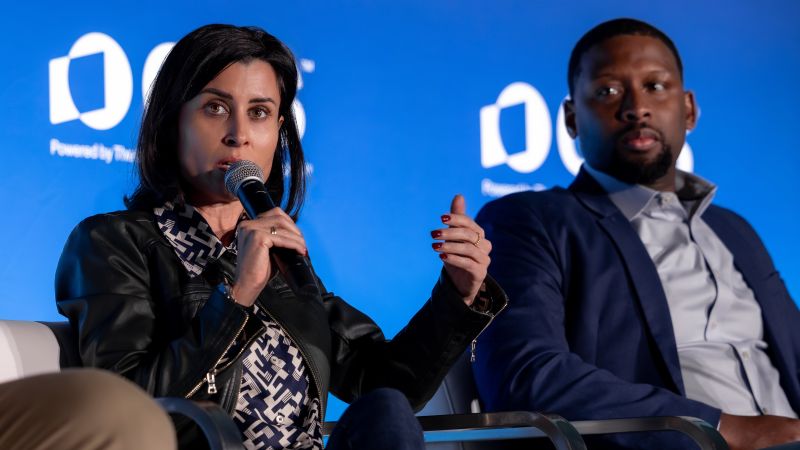 Claudia Gast speaking on a conference panel